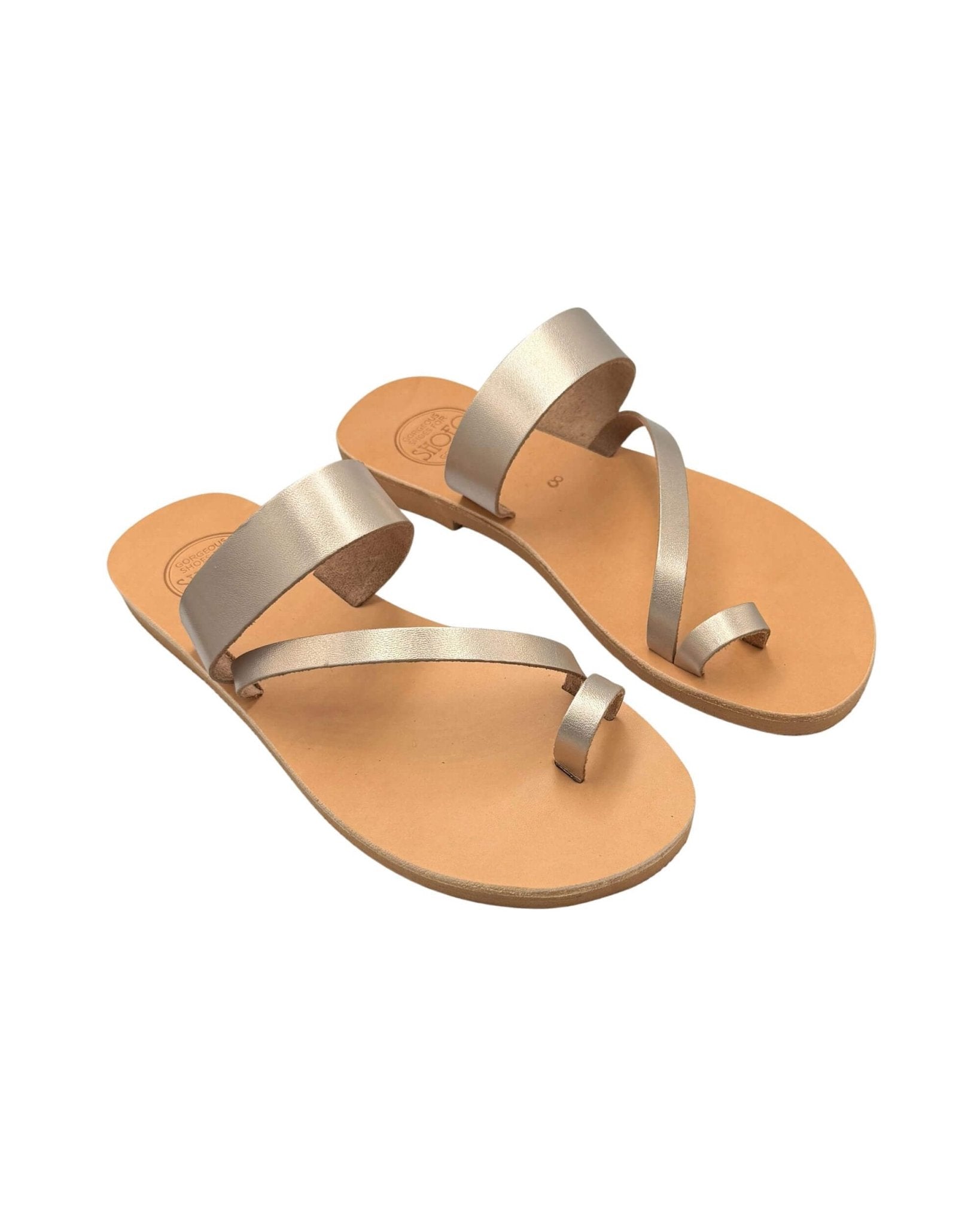 Athena bronze metallic leather slides side angle view
