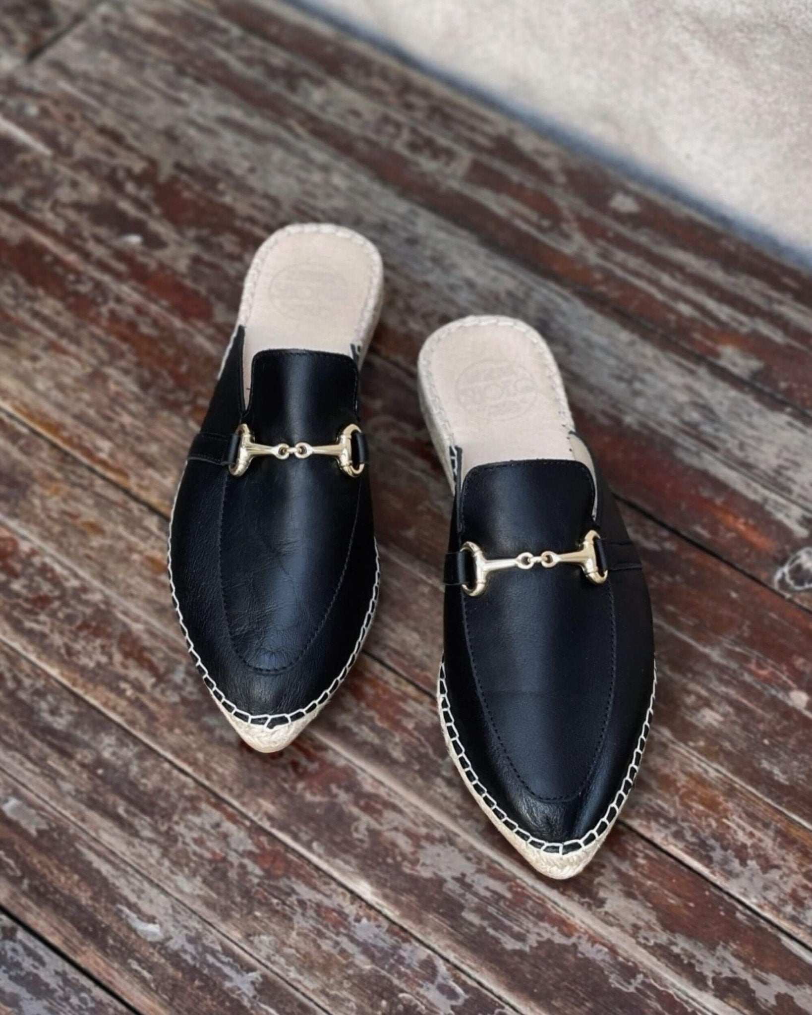 Spanish black mule shoes decorative hardware elegant
