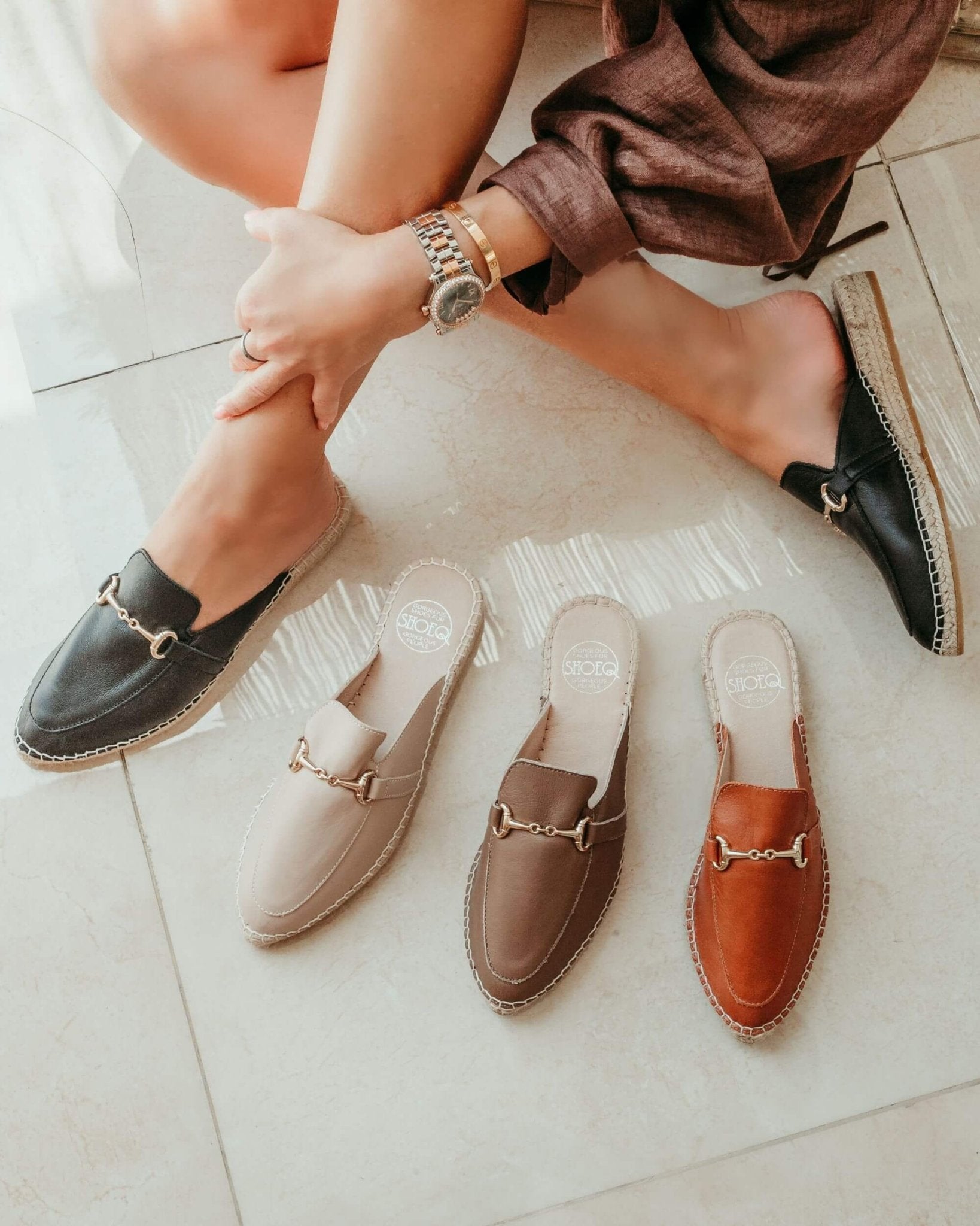 Spanish tan espadrille mules decorative hardware detail
