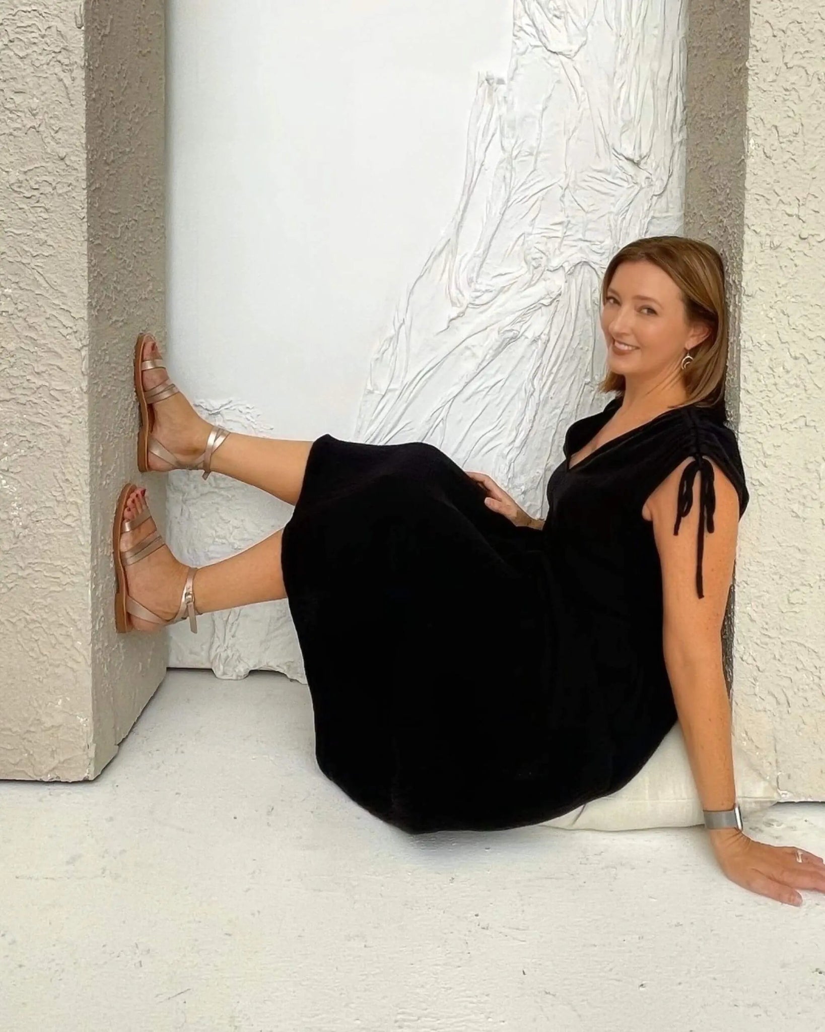 Greek artisan flat sandals bronze metallic on model Dubai