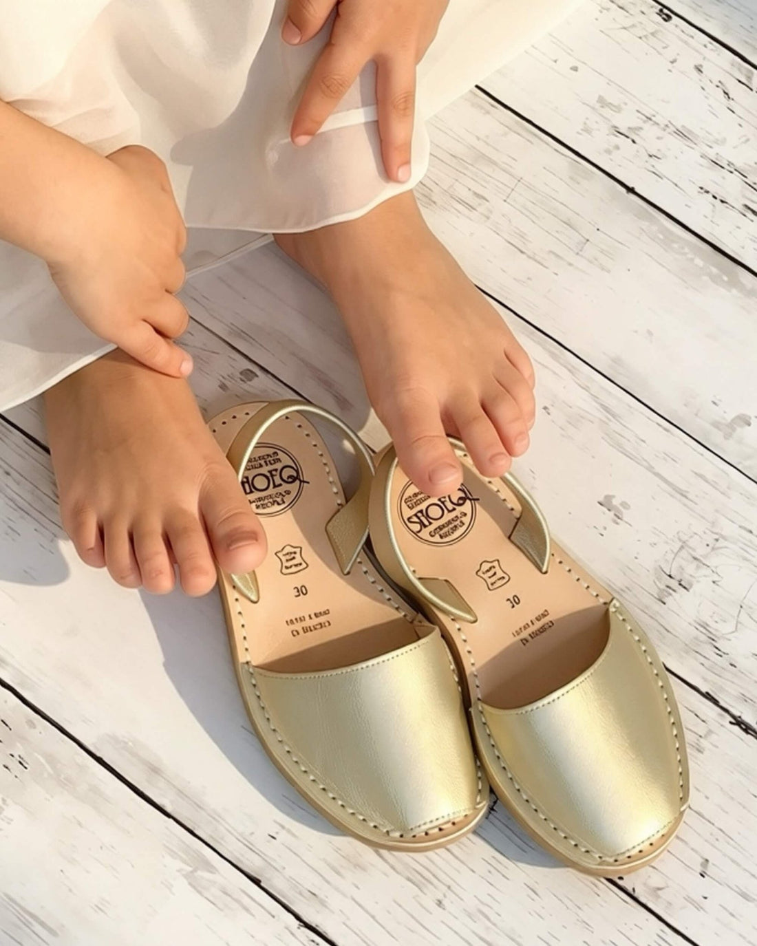 Champagne gold kids leather sandals — a secure strap and buttery-soft leather uppers, handmade in Menorca, Spain | Girls Classic Avarca by Shoeq