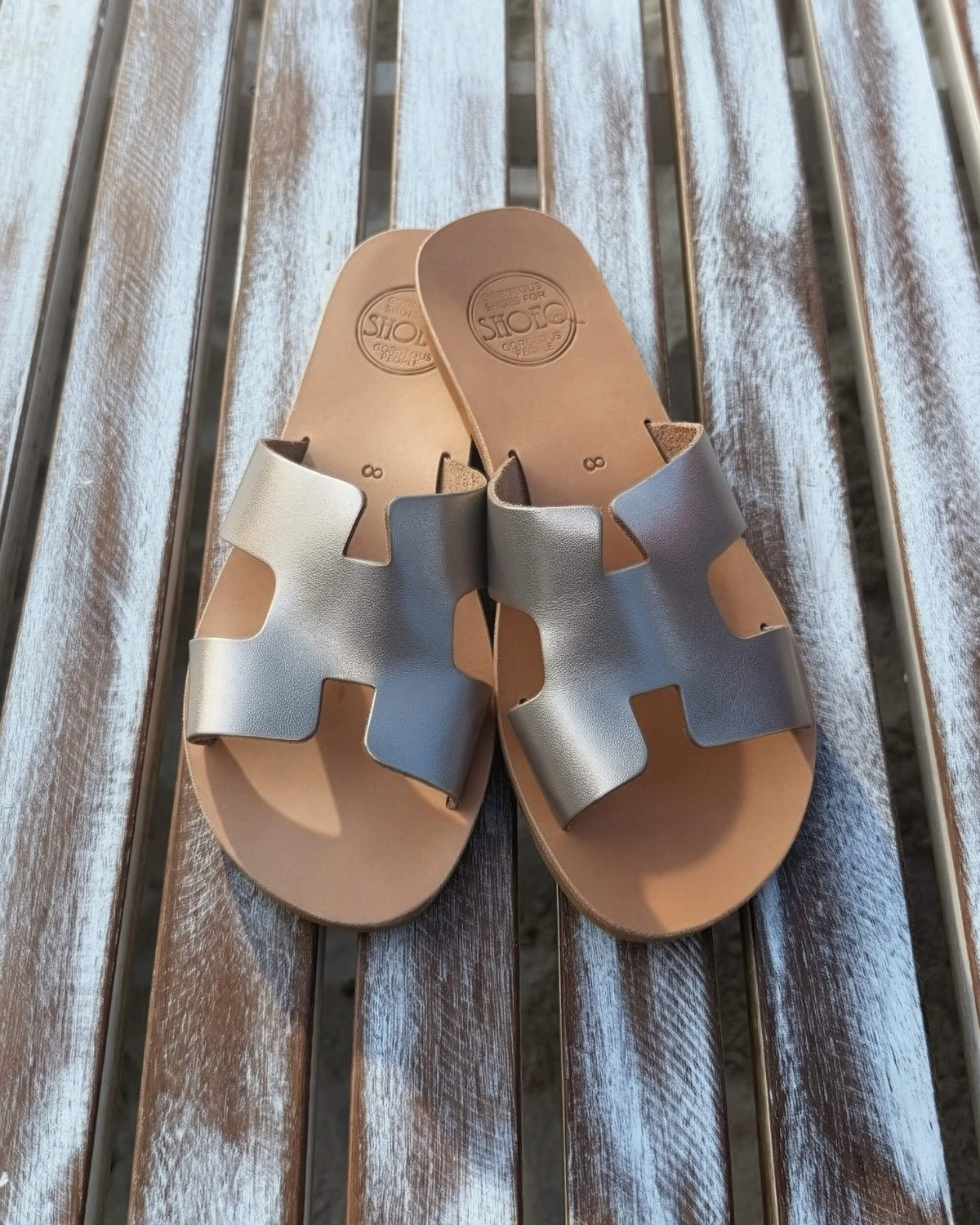 Bronze metallic slide sandals worn, lightweight flat leather design | Hania Slide by Shoeq
