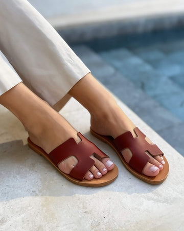 Close-up of chocolate brown flat sandals — soft leather and hand-stitched finish | Hania Slide by Shoeq