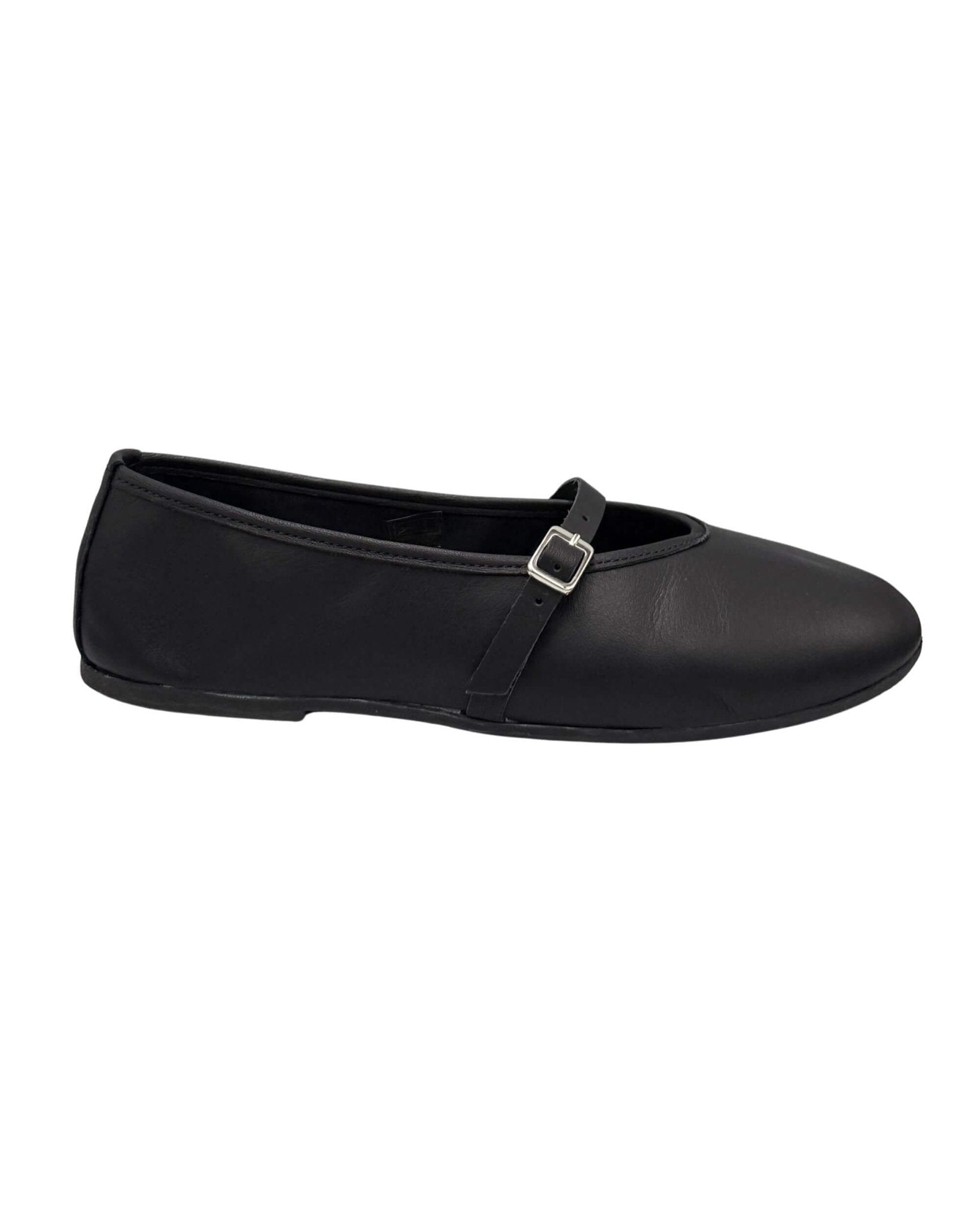 Side profile of handmade black nappa leather Mary Jane flat — ankle strap and silver buckle detail on white background | Mary Jane in Midnight by Shoeq