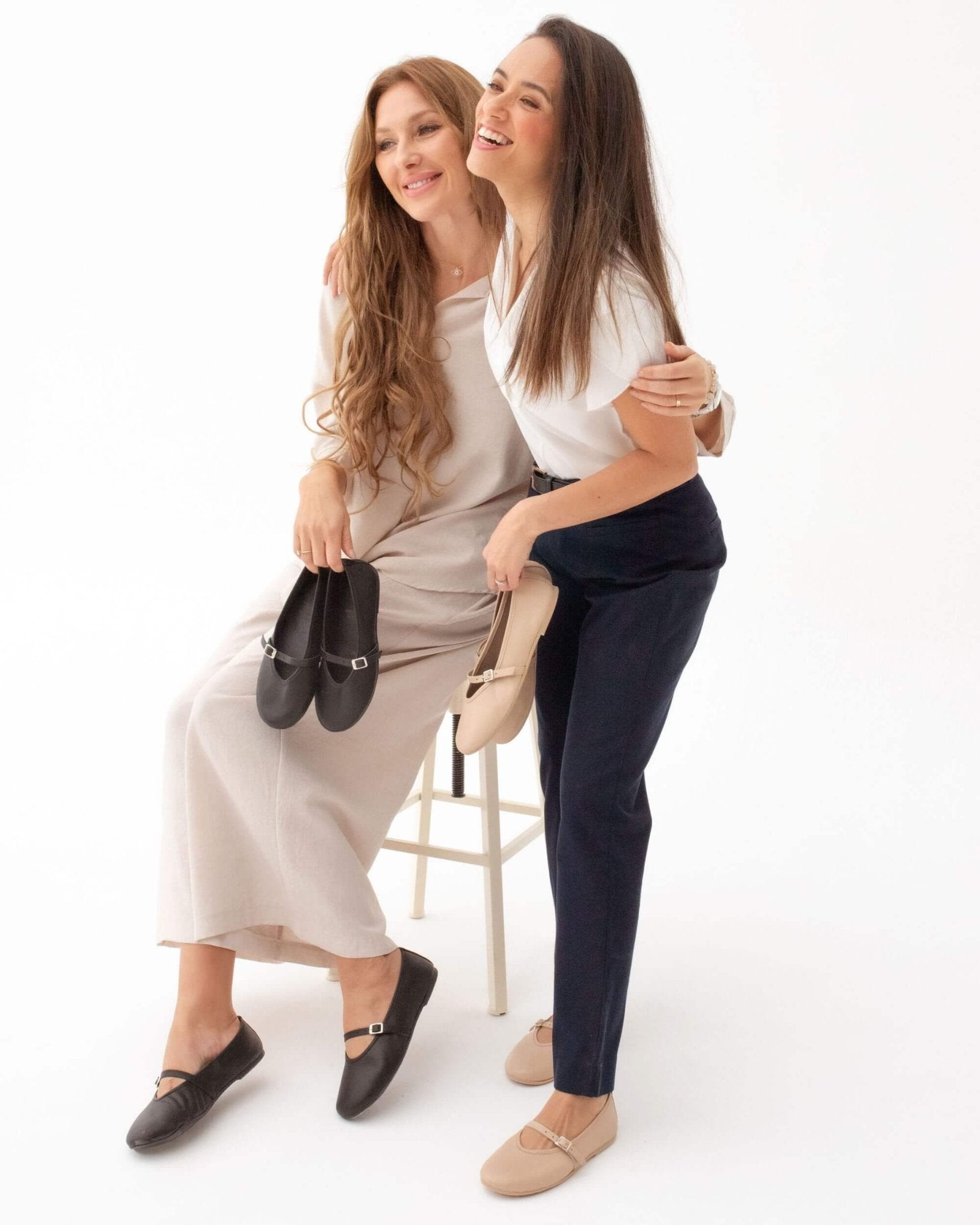 Handmade black nappa leather Mary Jane shoes in Midnight alongside Latte colour — two models showing both colourways | Mary Jane in Midnight by Shoeq