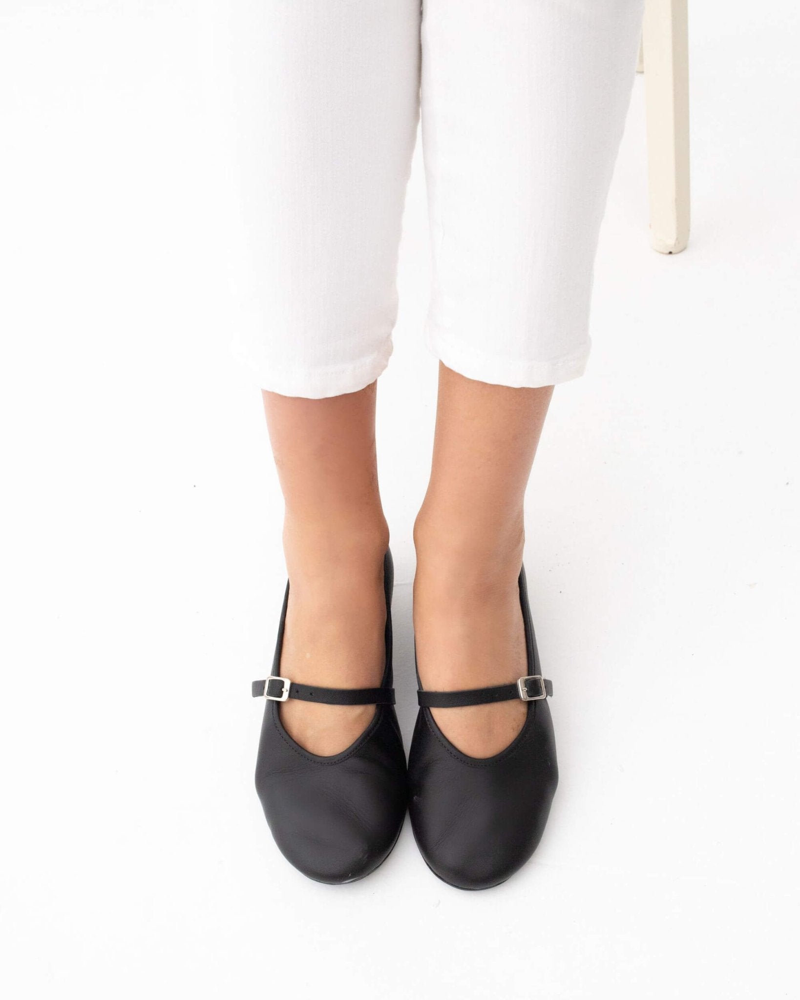 Handmade black nappa leather Mary Jane shoes with ankle strap and silver buckle — on-feet overhead view | Mary Jane in Midnight by Shoeq
